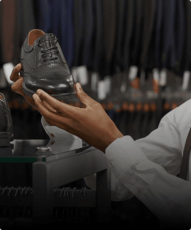 Cobbler repairing footwear.